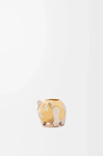 Dado pequeño con forma de animal en metal dorado/paladio