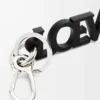 Dije LOEWE Signature en piel de becerro lisa. Negro Dije LOEWE Signature en piel de becerro lisa. Negro