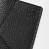 Funda para pasaporte Puzzle en piel de becerro granulada flexible. Color negro.