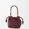 Mini bolso Flamenco en suave piel de cordero napa burdeos oscuro Mini bolso Flamenco en suave piel de cordero napa burdeos oscuro