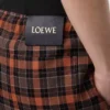 Pantalones cortos de mezcla de lana naranja/negro