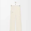 Pantalones suaves acampanados en jersey técnico marfil Pantalones suaves acampanados en jersey técnico marfil