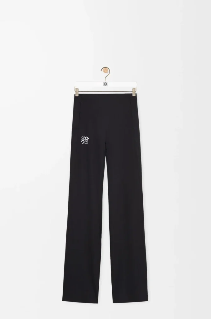 Pantalones suaves de corte acampanado en jersey técnico negro Pantalones suaves de corte acampanado en jersey técnico negro