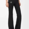 Pantalones suaves de corte acampanado en jersey técnico negro Pantalones suaves de corte acampanado en jersey técnico negro