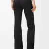 Pantalones suaves de corte acampanado en jersey técnico negro Pantalones suaves de corte acampanado en jersey técnico negro