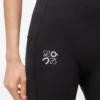 Pantalones suaves de corte acampanado en jersey técnico negro Pantalones suaves de corte acampanado en jersey técnico negro