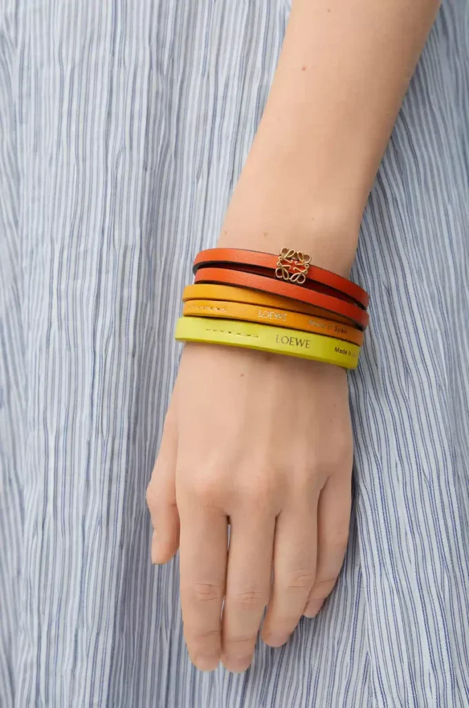 Pulsera doble trenzada en piel de becerro Naranja vivo/Amarillo Pulsera doble trenzada en piel de becerro Naranja vivo/Amarillo