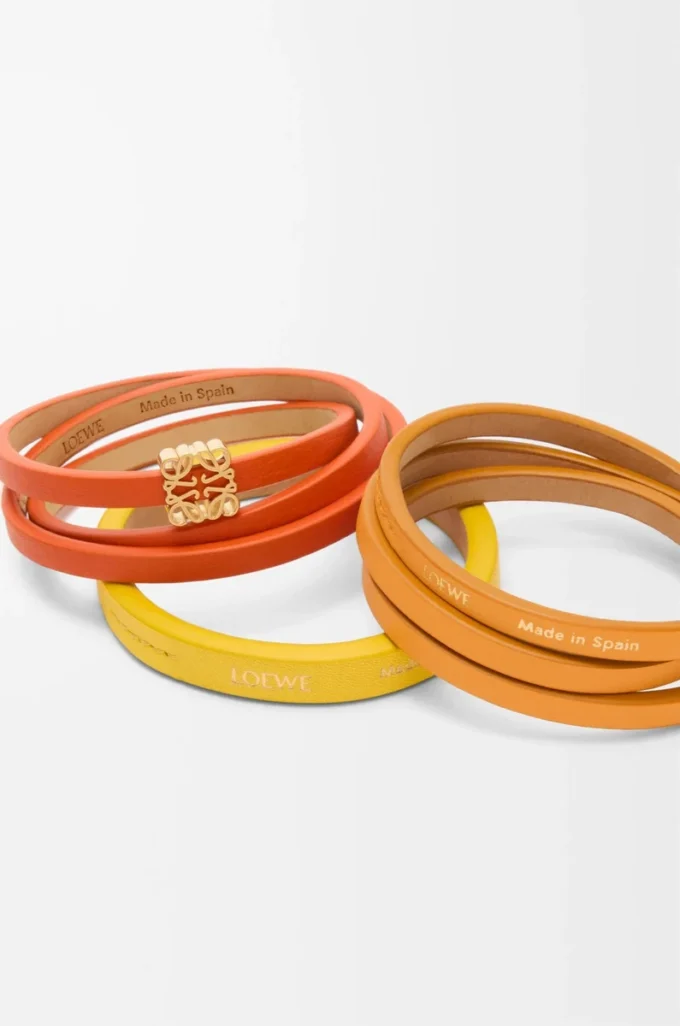 Pulsera doble trenzada en piel de becerro Naranja vivo/Amarillo Pulsera doble trenzada en piel de becerro Naranja vivo/Amarillo