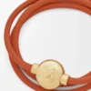 Pulsera Pebble de piel de becerro naranja/dorada Pulsera Pebble de piel de becerro naranja/dorada