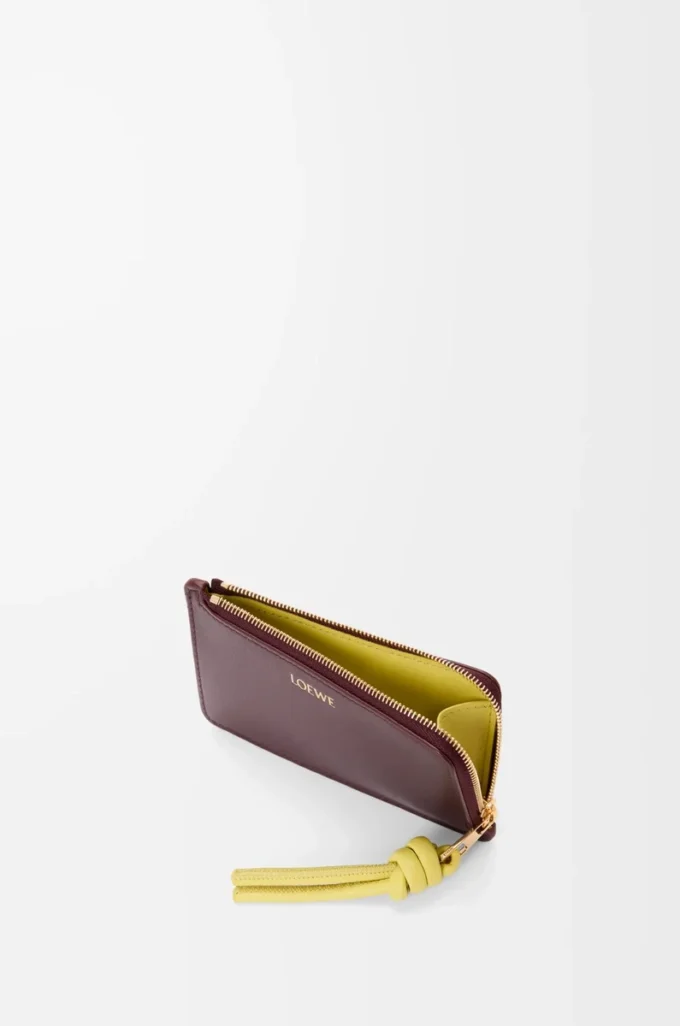 Tarjetero con nudo en piel de becerro napa brillante Dark Burgundy/Light Citrine