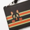 Tarjetero para monedas Futurist Cat en piel de becerro clásica, color marrón oscuro/naranja. Tarjetero para monedas Futurist Cat en piel de becerro clásica, color marrón oscuro/naranja.
