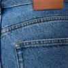 Vaqueros holgados Anagram en denim azul medio. Vaqueros holgados Anagram en denim azul medio.